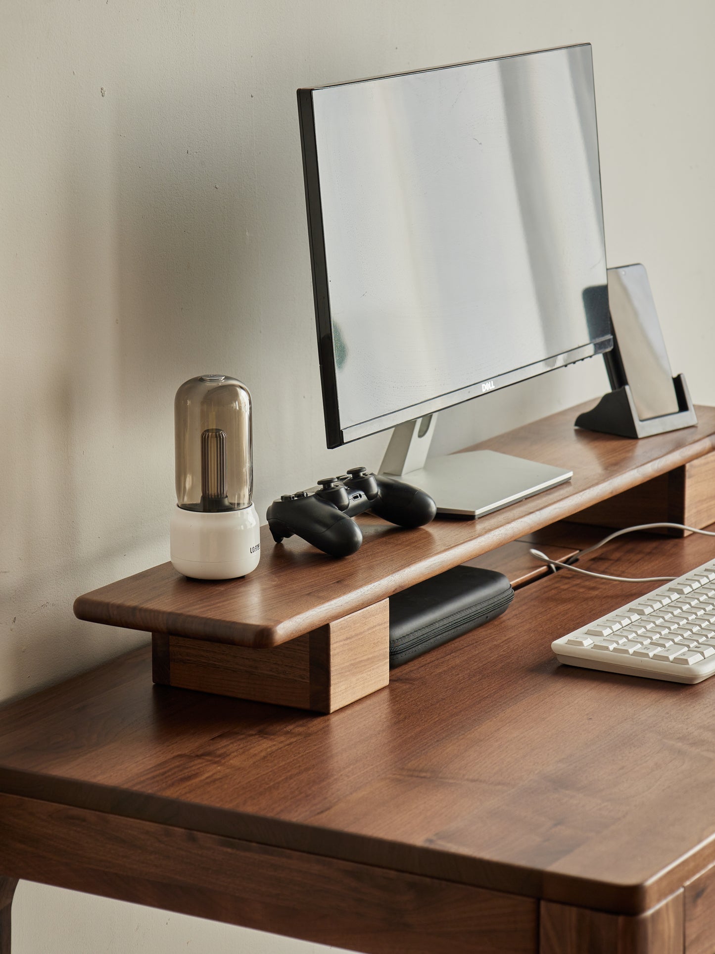 side view of FAS-grade walnut desk shelf with height-adjustable base 